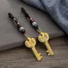 Colgante de llave de bóveda abierta con lingote de pez doble del zodíaco de imitación de latón, colgante de cuerda de nube auspiciosa de los doce zodíacos, venta al por mayor