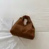 Bolso de mano Ruien elegante con textura para dumplings para mujer, nuevo modelo de otoño 2026, bolso de mano retro único y moderno
