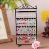 Estante para aretes de hierro forjado metálico de 48 agujeros estante de exhibición de joyas para aretes y colgantes estante para joyas accesorios de joyería estante promocional