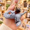 Celebridade online Tiranossauro mordendo brinquedo chaveiro criativo dinossauro pequeno pingente casal mochila pingente pequeno presente atacado