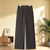 Pantalones rectos de pierna ancha de alta gama y corte slim para mujer, nuevo estilo otoño e invierno 2026, pantalones para mujeres de mediana edad y mayores, cintura elástica, pantalones de pierna ancha de color liso