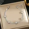 Pulseira de Aço Titânio Elegante Simples de Luxo Estilo Coreano com Design Integral para Mulheres Joia Transfronteiriça de Alto Padrão com Cravação de Diamantes Trevo de Quatro Folhas que Não Desbota