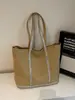 Bolsa de Lona de Grande Capacidade Feminina Outono e Inverno 2025 Nova Bolsa de Ombro de Alta Qualidade para Estudante Universitário e Comutador
