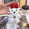 Novo Urso de Pelúcia Fofo com Laço que Faz Barulho Boneca Pingente para Bolsa Chaveiro Brinquedo Venda por Atacado
