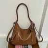 Bolsa multifuncional transfronteiriça para mulheres, nova coleção de outono 2026, mochila estilosa e retrô, bolsa de viagem leve, bolsa de ombro e bolsa transversal
