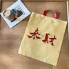 Bolsa Tote Loja de Roupas Espessada Prosperidade de Ano Novo Bolsa de Presente Vermelha e Dourada Festiva e Prática Parabéns pela Riqueza Bolsa Tote de Plástico