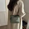Nuevo diseño de nicho transfronterizo estilo japonés ins casual simple moda bolsa de hombro para teléfono de nailon bolsa cruzada a cuadros