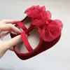 Suministro directo de fábrica nuevos zapatos coreanos para bebés y niños pequeños antideslizantes elásticos resorte y otoño lazo zapatos de princesa