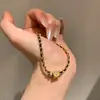 Anillo Corredor Dorado de Explosiones de Libro de Caperucita Roja Pulsera de Oro Negro Cadena Estilo Chanel Simple y a la Moda para Mujer Cuerda de Mano Trenzada Flash Cepillada