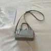 2026 Verão Versão Coreana Casual Bolsa Almofada de Mão Nova Padrão Trançado Bolsa Feminina Alta Estética Transversal Ombro Mochila Pequena