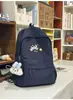 Mochila bordada com filhote de cachorro pintado em azul névoa e branco leitoso para estudantes, adequada para meninas, leve e versátil para o trajeto diário.