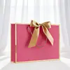 Empaque Lazo de Regalo Personalizado Bolsa de Papel de Mano Bolsa de Compras Lista para Usar Exportación Transfronteriza Impresión de Logotipo Fabricante Envío Gratis