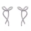 Pendientes de borla con lazo de diseño de nicho de lujo ligero, elegantes y de alta calidad, con personalidad única, estilo frío para mujer.