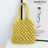 Bolso de Mano Tejido Versátil Primavera/Verano 2026 Bolso Hueco para Mujer Bolso de Punto Nuevo de Moda Estilo Ins Bolso de Playa