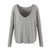Conjunto de tres piezas para mujer en otoño: top de tirantes a rayas bicolor + camiseta de blusa holgada de manga larga con cuello en V + pantalones de campana de cintura alta