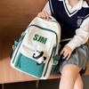 Mochila 2024 nova mochila escolar para estudante do ensino fundamental estilo coreano moda cor contrastante mochila grande capacidade marca de moda bolsa comércio exterior