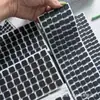 Fabricante de Almohadillas de Silicona Redondas Irregulares con Rejilla Adhesiva Negra Anti-Colisión Amortiguadoras Resistentes al Desgaste para Muebles, Patas de Goma Autoadhesivas