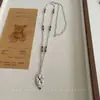 Colar em camadas único de outono e inverno com pedra olho de tigre Maillard, design de luxo leve, corrente longa para suéter, acessório versátil vintage