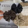 Presilha banana elegante com poá e laço plissado para mulheres, acessório de cabelo de alta qualidade para realçar o volume, presilha para rabo de cavalo