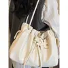 Directo del fabricante: Bolso tipo cubo de moda de gran capacidad para mujer, nueva versión coreana de tendencia 2026, bolso de hombro versátil vintage