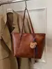 Yue Zi 2026 Otoño/Invierno Nuevo Retro para Viajes al Trabajo Gran Capacidad Alta Apariencia Elegante Bolso Tote Casual Bolso de Hombro