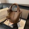 Bolso de mano de cuero suave texturizado para mujer 2024 nueva moda patrón de lichi bolso cubo casual de hombro bandolera