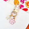 Llavero de metal de gran oferta transfronteriza, colgante de bolso con flores pequeñas, accesorios de joyería, llavero estilo Ins de Corea del Sur.