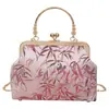 Bolso de mano versátil transfronterizo de nuevo estilo chino, con un diseño tradicional chino, estilo cheongsam retro, adecuado para eventos nocturnos, y una versión moderna y de moda del clásico bolso de hombro y bolso cruzado