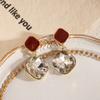 Aretes estilo coreano con incrustaciones de diamantes Aretes de alta gama rojo Ancora Aretes únicos de moda de lujo ligero para mujer al por mayor
