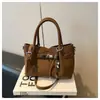 Bolso Pequeño Versátil Transfronterizo para Mujer 2026 Nuevo Primavera/Verano Bolso Cubo Simple Textura de Alta Calidad Bolso Cruzado para Viajes