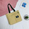 Bolso de lona de color liso 2023, estilo japonés, informal, para hombro, combinable, sencillo, para estudiantes, de gran capacidad, moderno para mujer.