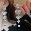 Aretes de Aguja Plateada con Borlas de Gota de Agua Incrustadas de Diamantes, Estilo Palacio, Nicho, Aretes Versátiles, Lujo Ligero, Venta al por Mayor de Aretes de Gama Alta