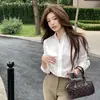 Nuevo top versátil y elegante de otoño, holgado, camisa blanca pura de manga larga, casual y a la moda, para mujer