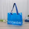 Bolsas de mano transparentes de PVC personalizadas transfronterizas, bolsas de compras para tiendas de ropa de lotes pequeños, bolsas de regalo co-branded de IP de apoyo a celebridades