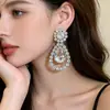 Pendientes de gota de agua incrustados con diamantes transfronterizos europeos y americanos, Pendientes sencillos y de moda, Lujo ligero, Sensación de alta gama, Accesorios para orejas inspirados en el diseño