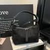 Bolso de mano vintage de nicho transfronterizo para mujer, nuevo modelo otoño 2026, bolso de hombro cruzado individual, bolso estilo bola de masa de alta gama elegante