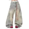 Jeans de pierna ancha sueltos hasta el suelo, estilo hip-hop de alta calle retro americano, desgastados y teñidos, 2026