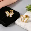 Fabricante de conjunto de joyería de mariposa concha estilo francés transfronterizo, combinación de collar, pulsera y pendientes de nicho de alta gama para mujer