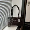 Bolso de axila grande retro y minimalista para mujer, nuevo bolso de hombro casual y elegante 2026, gran capacidad, adecuado para ir al trabajo y se puede llevar como bolso de mano.