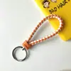 Llavero creativo de cuerda de cuero tejido a mano para pareja, llavero de coche, llavero al por mayor, colgante para bolso