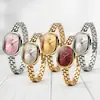 Reloj popular para mujer transfronterizo, reloj versátil artístico de alto valor de nicho, simple y elegante para mujer con esfera ovalada