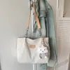 Bolso para estudiante universitaria para mujer, nuevo estilo minimalista 2026, bolso de hombro moderno de gran capacidad, bolso de mano simple para el día a día