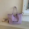 Bolsa de Lona con Estampado de Letras para Viajes Transfronterizos para Mujer 2026 Nueva Moda Gran Capacidad Versátil Ligera Bolso de Hombro