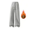 Calça de moletom masculina TK transfronteiriça europeia e americana com forro de fleece, cordão, perna reta larga, modelagem solta, calça esportiva longa com bolsos