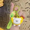 Líneas creativas de dibujos animados muñeco perrito llavero lindo colgante de muñeca coche bolsa pareja regalo pequeño venta al por mayor