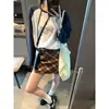 Mocci Otoño Nuevo Estilo Coreano Retro Bloque de Color Cuadros Cintura Alta Adelgazante Falda Mini Línea A con Cinturón MQ1748