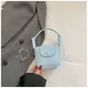 Mini Bolso de Color Sólido Estilo Coreano para Mujer 2026 Primavera Nueva Moda Elegante Bolso Silla de Montar Ligero Versátil Bolso para Auriculares