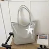 Bolso tote tejido de estilo europeo y americano de gran capacidad con colgante de encaje de estrella, bolso de hombro versátil para estudiantes, bolso de mano, bolso de axila