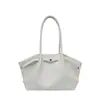 La popular bolsa de cubo fresca de mano para mujer de este año, nuevo estilo Otoño 2026, bolso de hombro único plisado de color liso, bolso de axila para ir al trabajo
