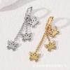 Aretes de Acero de Titanio de Nicho Europeos y Americanos Transfronterizos para Mujer, Aretes de Mariposa Huecos con Borla Modernos y Versátiles, Aretes de Lujo Ligero y de Alta Gama